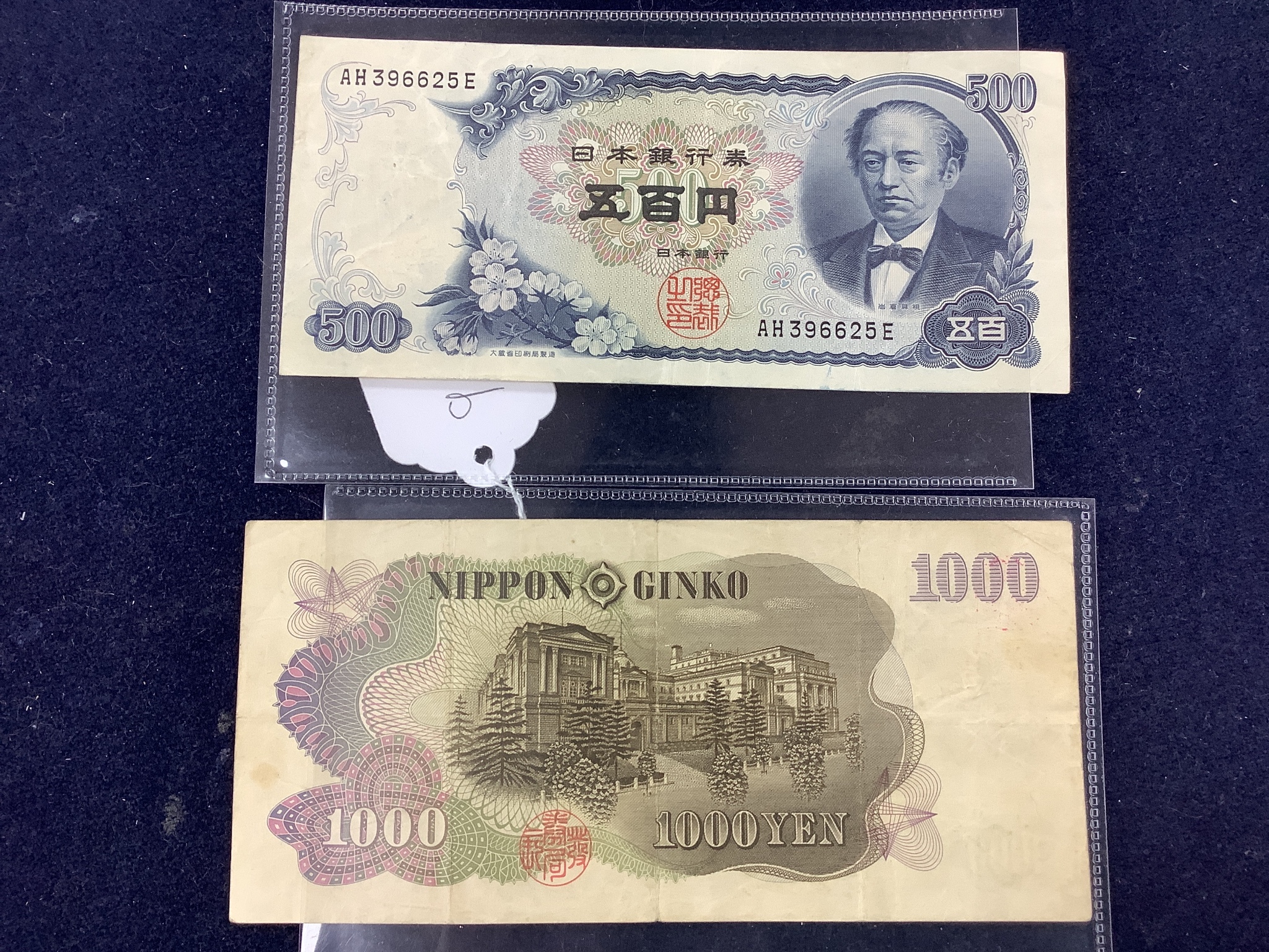 A collection of Chinese coins, stamps and two Japanese banknotes